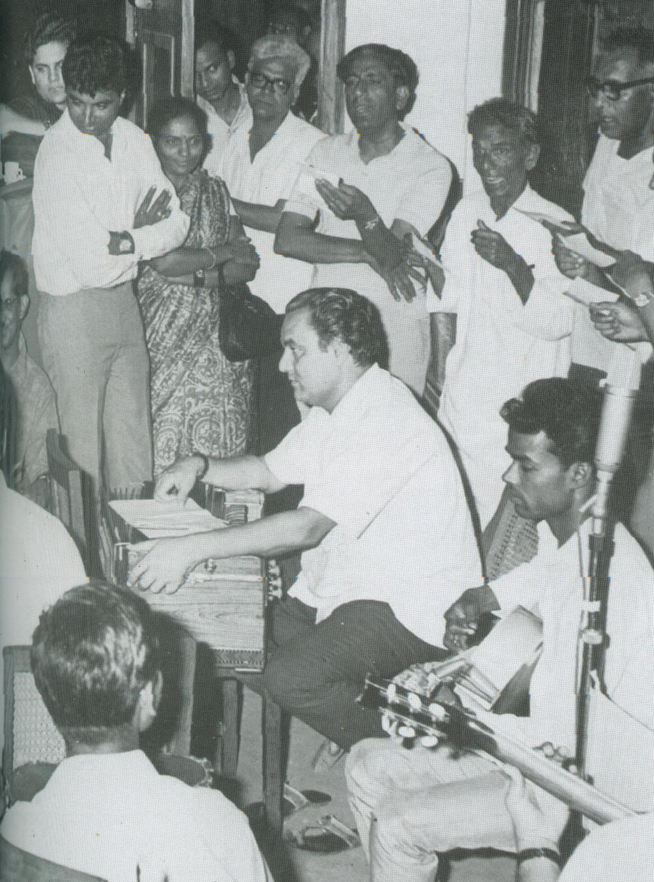 Mukesh with chorus in a song rehearsal