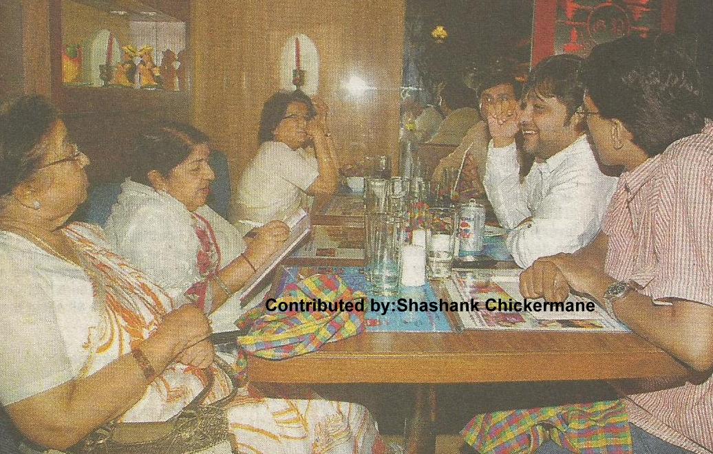 Lata with Usha & Meena Mangeshkar with others in the party