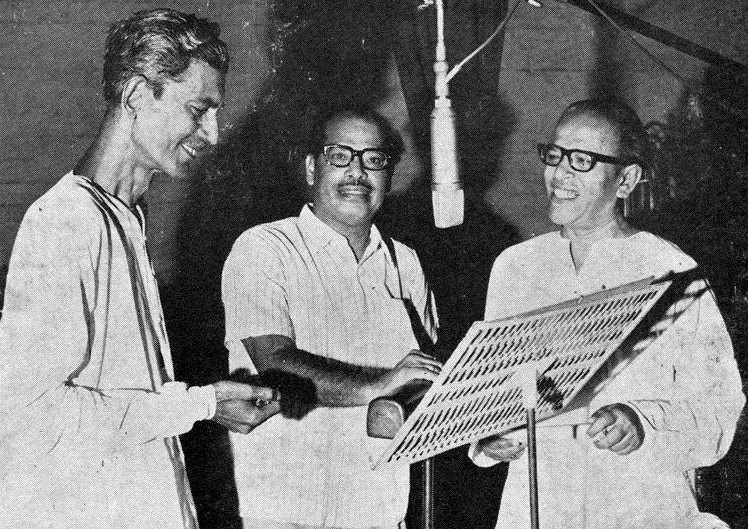 Mannadey recording a song with others in the recording studio