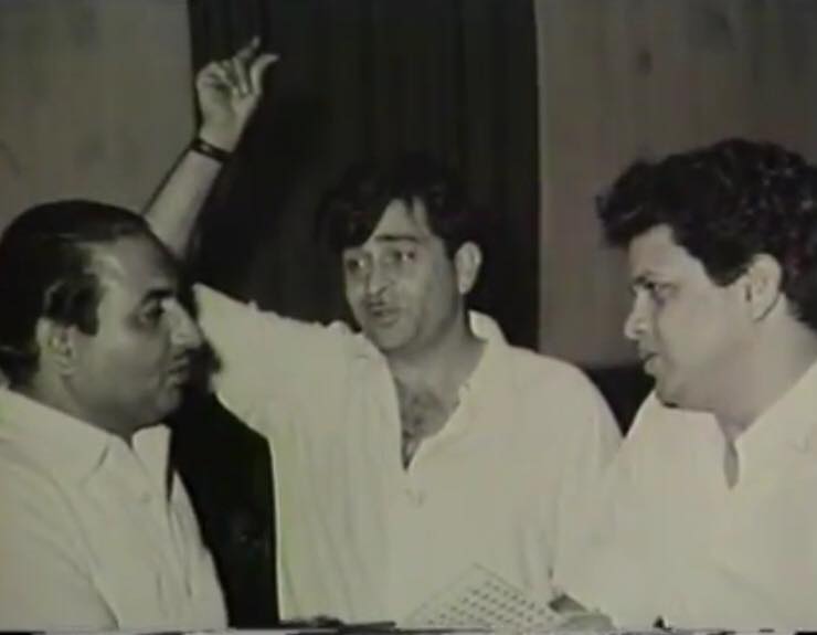 Raj Kapoor discussing with Mohd Rafi & Jaikishan in the recording studio