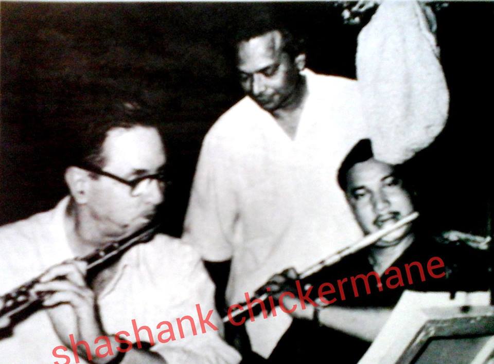 Naushad with musicians in the recording studio