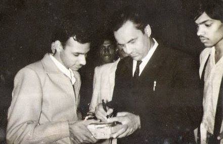 Mukesh giving autograph to his fans