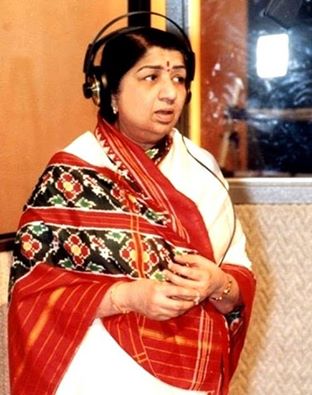 Lata recording a song in the studio