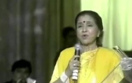 Asha Bhosale singing in a concert