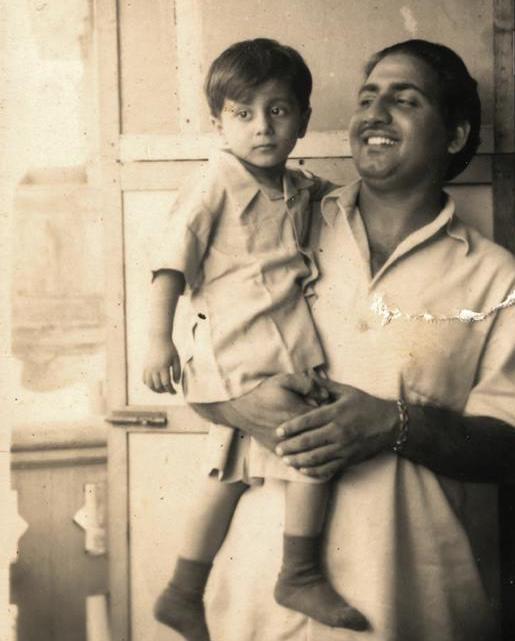 Rafi holding his son