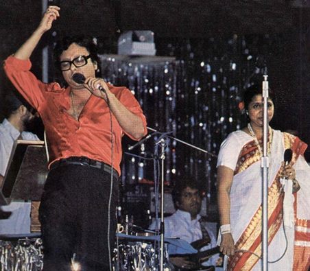 RD Burman with Asha singing in a concert