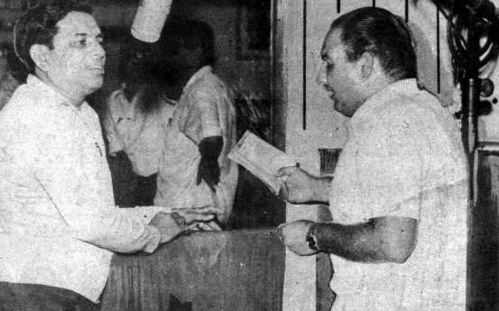 Mohammad Rafi recording a song with the music director Ravi in the recording studio