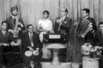 Mannadey with others in a concert