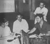 Jaikishan rehearsals a song with Asha, Hasrat & others