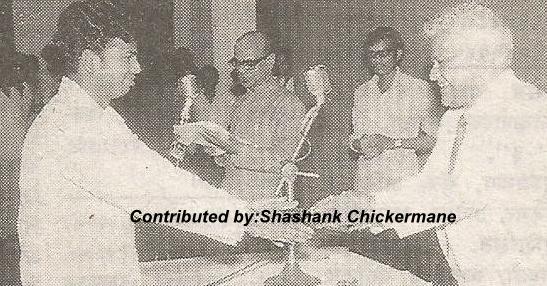 Vasant Desai giving awards