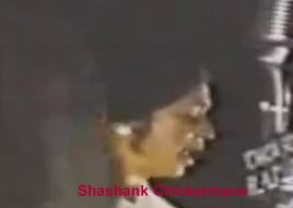 Asha Bhosale singing in a concert