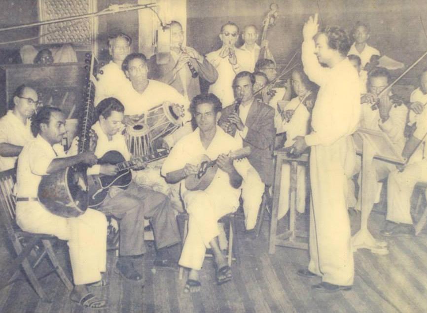 Naushad with his musicians in the recording studio