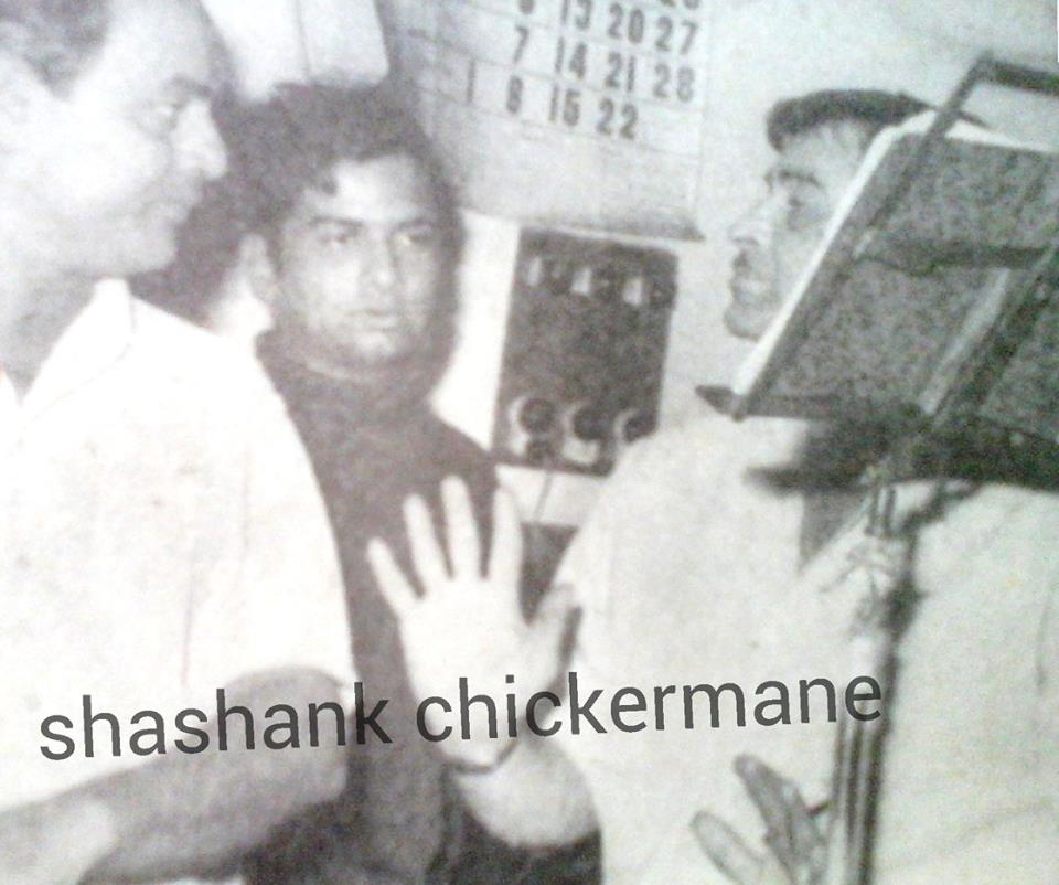 Mukesh discussing with Raj Kapoor in the recording studio