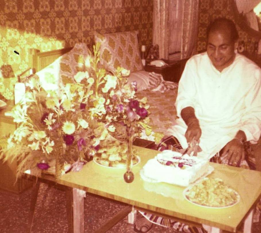 Mohd Rafi cutting birthday cake in his house