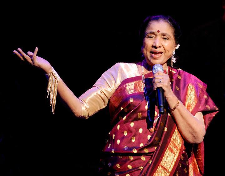 Asha Bhosale singing in a concert