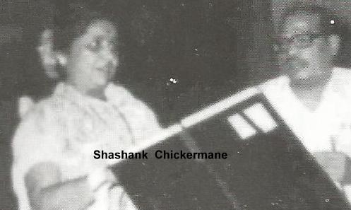 Lata with Mannadey recording a duet song in the recording studio