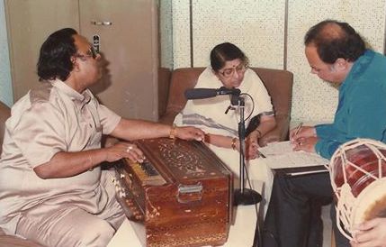 Lata with Ravindra Jain & others in the recording studio