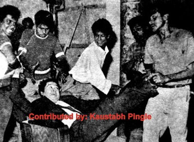 Kishoreda enjoying a scene with others in the film scene