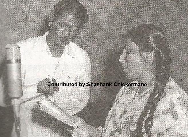 Suman Kalyanpur recording a song with Music Director Vasant Shinde in the recording studio