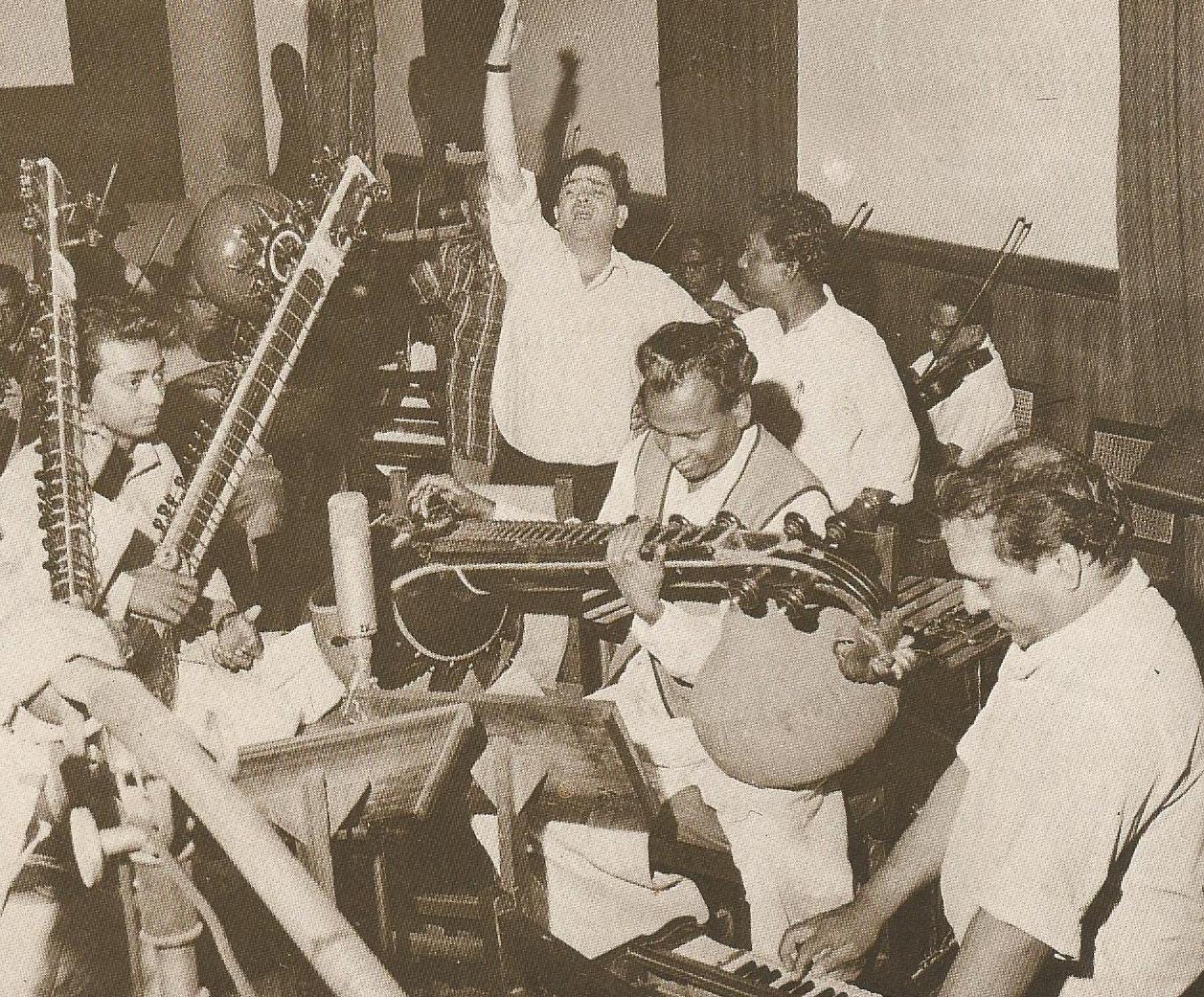 Shankar with Raj Kapoor & musicians recording a song in the recording studio