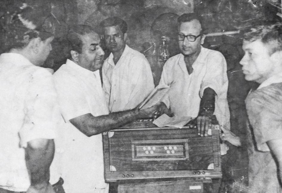 Rafi rehearsaling a song along with Bappi Lahiri's father in the studio