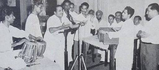 Mohd Rafi recording a song with others in the recording studio