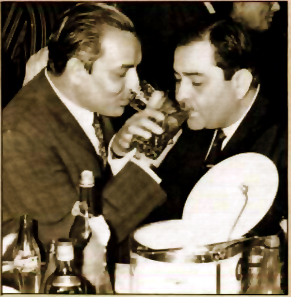 MUKESH  AND RAJKAPOOR SHARING A DRINK WITH EACH OTHER