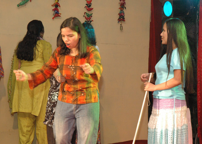Blind children on the stage during the play