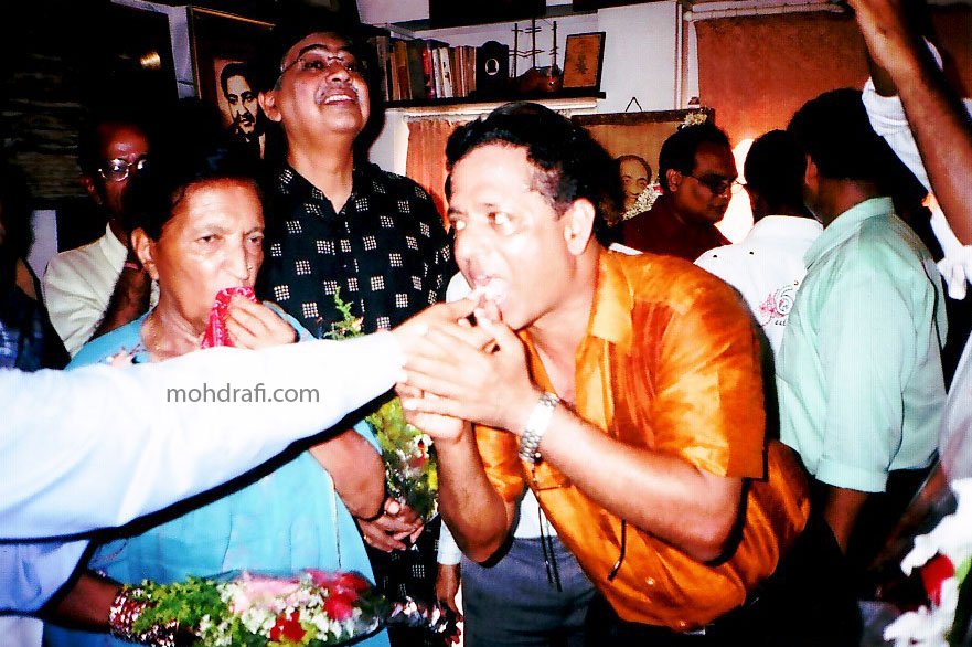 P4 - Birthday cake being shared, Binu Nair and Mubarak Begum seen in the picture