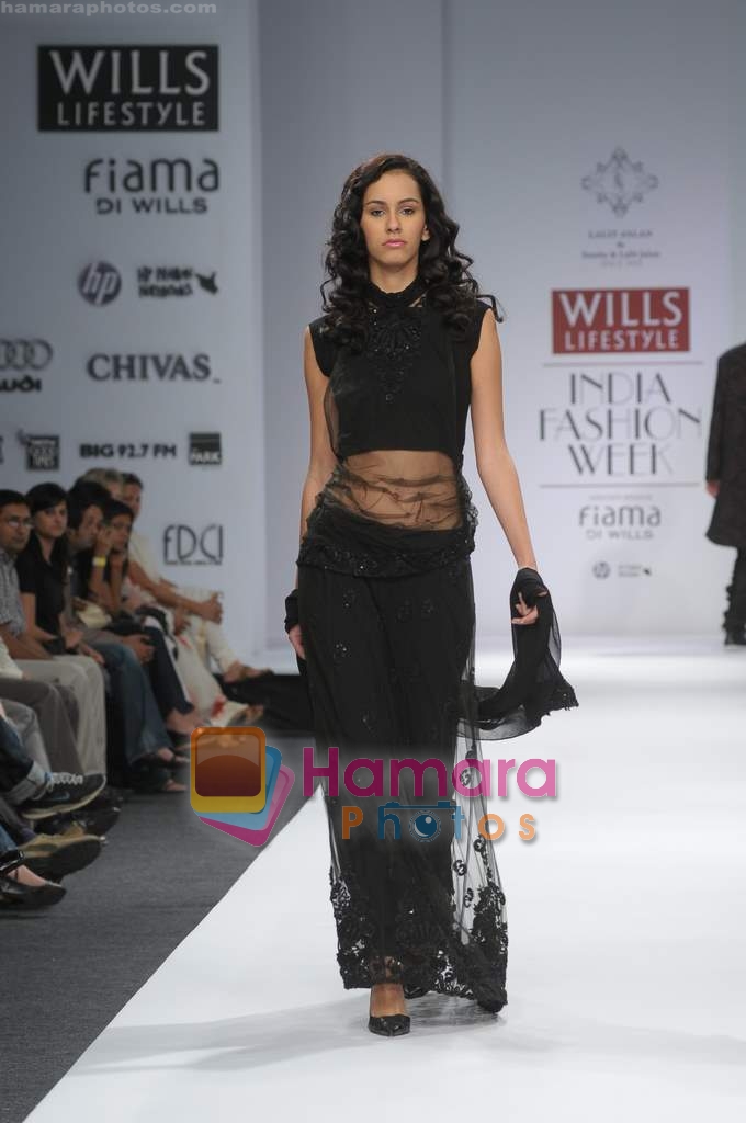 Models showcase designs of Sunita and Lalit Jalan during Wills Fashion Week on Oct 18, 2008 