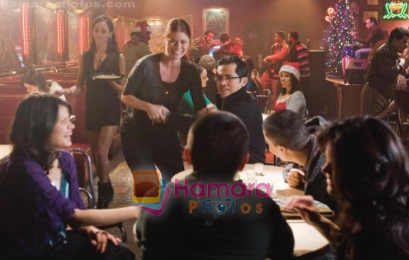 John Leguizamo, Debra Messing, Melonie Diaz in still from the movie Nothing Like the Holidays