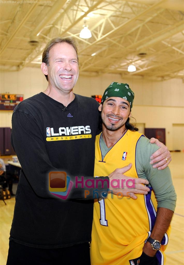 Asst Coach Kurt Rambis and Bollywood actor Dino Morea share a hearty laughter at the NBA practice session in The Staples Center, Los Angeles, California on 23rd November 2008