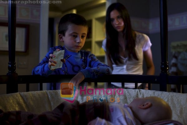 Odette Yustman, Atticus Shaffer in still from the movie The Unborn