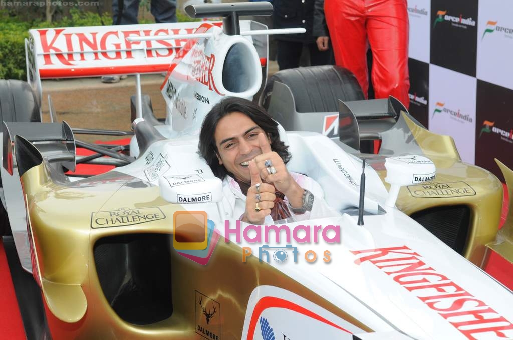 Arjun Rampal in F1 car at the launch of Force India Formula One season 2009 Calendar in The Hub, Emporio Mall, New Delhi on 12th Jan 2009