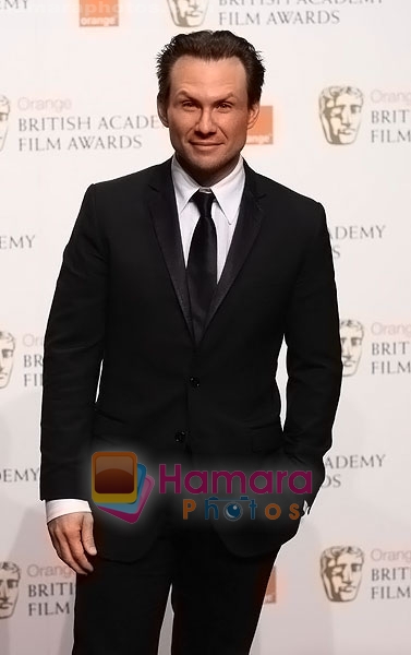 Christian-Slater-poses-at-the-winner's-board-at-The-Orange-British-Academy-Film-Awards-held-at-the-Royal-Opera-House-on-February-8,-2009-in-London,-England