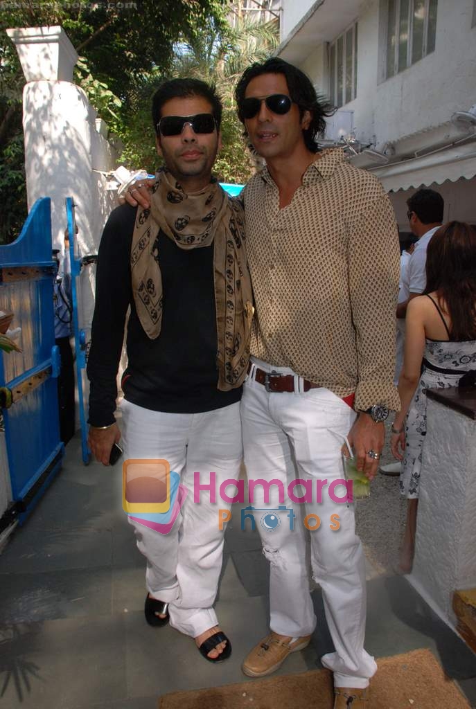 Karan Johar with Arjun Rampal at the celebration of Rock in Olive on 9th March 2009