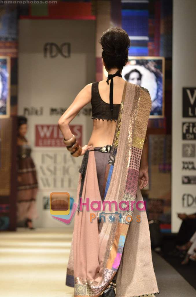 Model walks the ramp for Niki Mahajan show on Wills Lifestyle India Fashion Week 2011-Day 4 in Delhi on 9th April 2011 