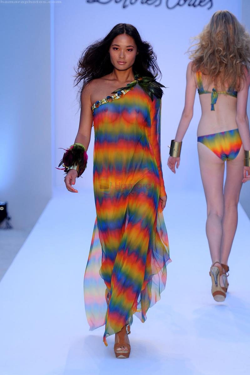 A model walks the runway at the Dolores Cortes swim show during Mercedes-Benz Fashion Week Swim 2012 at The Raleigh on July 16, 2011 in Miami Beach, Florida
