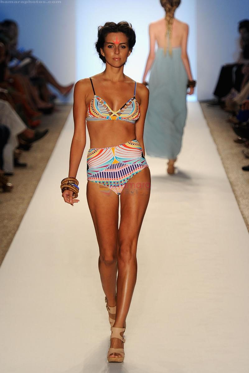 A model walks the runway at the Mara Hoffman Swim show during Mercedes-Benz Fashion Week Swim 2012 at The Raleigh on July 16, 2011 in Miami Beach, Florida