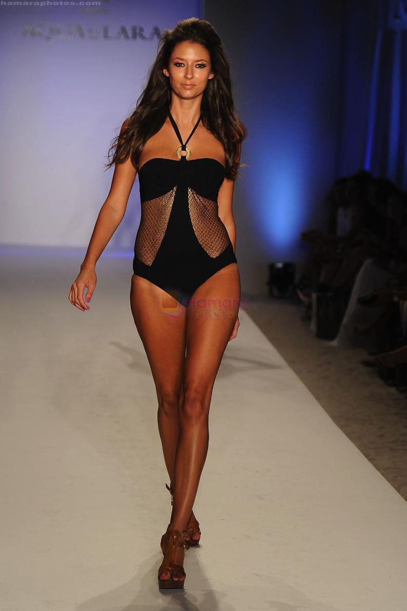 A model walks the runway at the Aqua Di Lara show during Mercedes-Benz Fashion Week Swim 2012 at The Raleigh on July 16, 2011 in Miami Beach, Florida