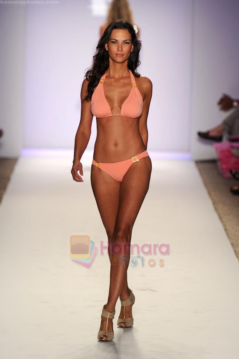 A model walks the runway at the Jogo Beach show during Merecedes-Benz Fashion Week Swim 2012 on July 18, 2011 in Miami Beach, United States