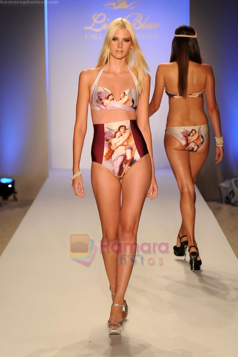 A model walks the runway at the Lisa Blue show at Mercedes-Benz Fashion Week Swim 2012 at The Raleigh on July 17, 2011 in Miami Beach, Florida
