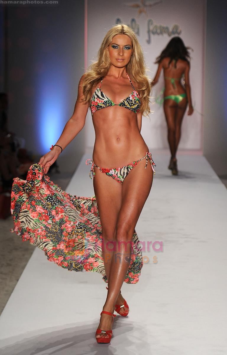 A model walks the runway at the Luli Fama show during Mercedes-Benz Fashion Week Swim 2012 at The Raleigh on July 17, 2011 in Miami Beach, Florida