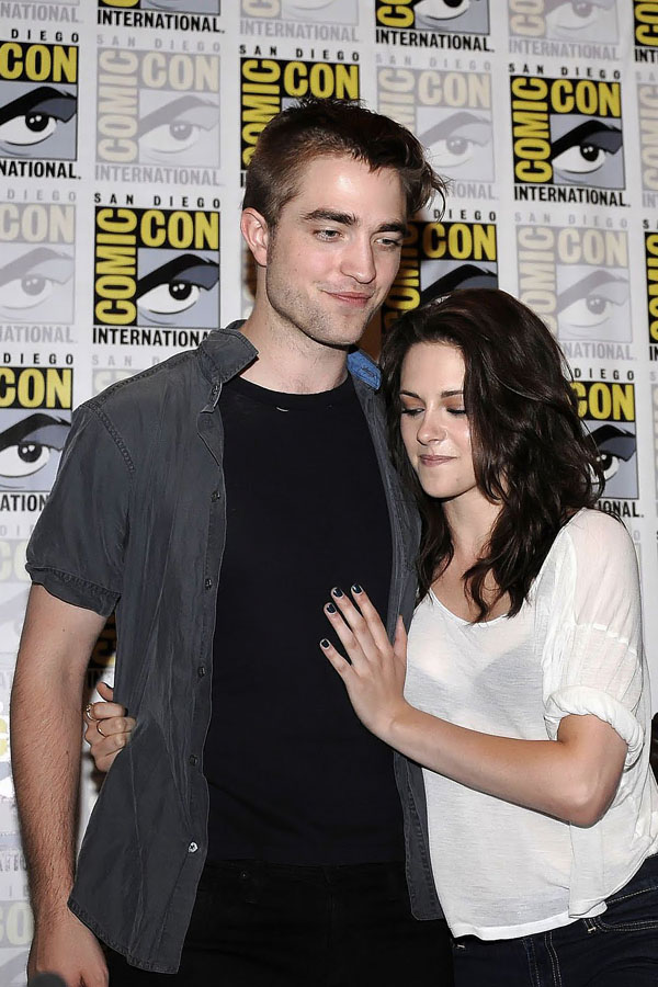 Robert Pattinson, Kristen Stewart poses to promote Breaking Dawn from the Twilight Saga at  the 2011 Comic-Con International Day 1 at the San Diego Convention Center on July 21, 2011