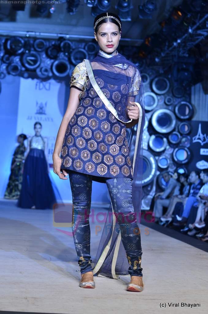 Model walk the ramp for JJ Valaya's fashion show at the Synergy1 Delhi Couture Week 2011 in Delhi on 22nd July 2011