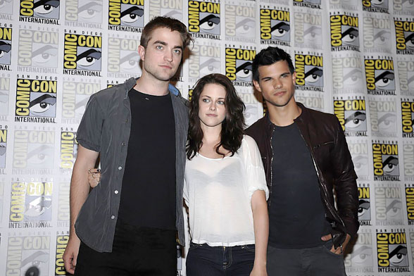 Taylor Lautner, Kristen Stewart, Robert Pattinson poses to promote Breaking Dawn from the Twilight Saga at  the 2011 Comic-Con International Day 1 at the San Diego Convention Center on July 21, 2011