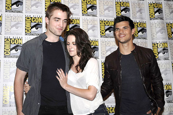 Taylor Lautner, Kristen Stewart, Robert Pattinson poses to promote Breaking Dawn from the Twilight Saga at  the 2011 Comic-Con International Day 1 at the San Diego Convention Center on July 21, 2011