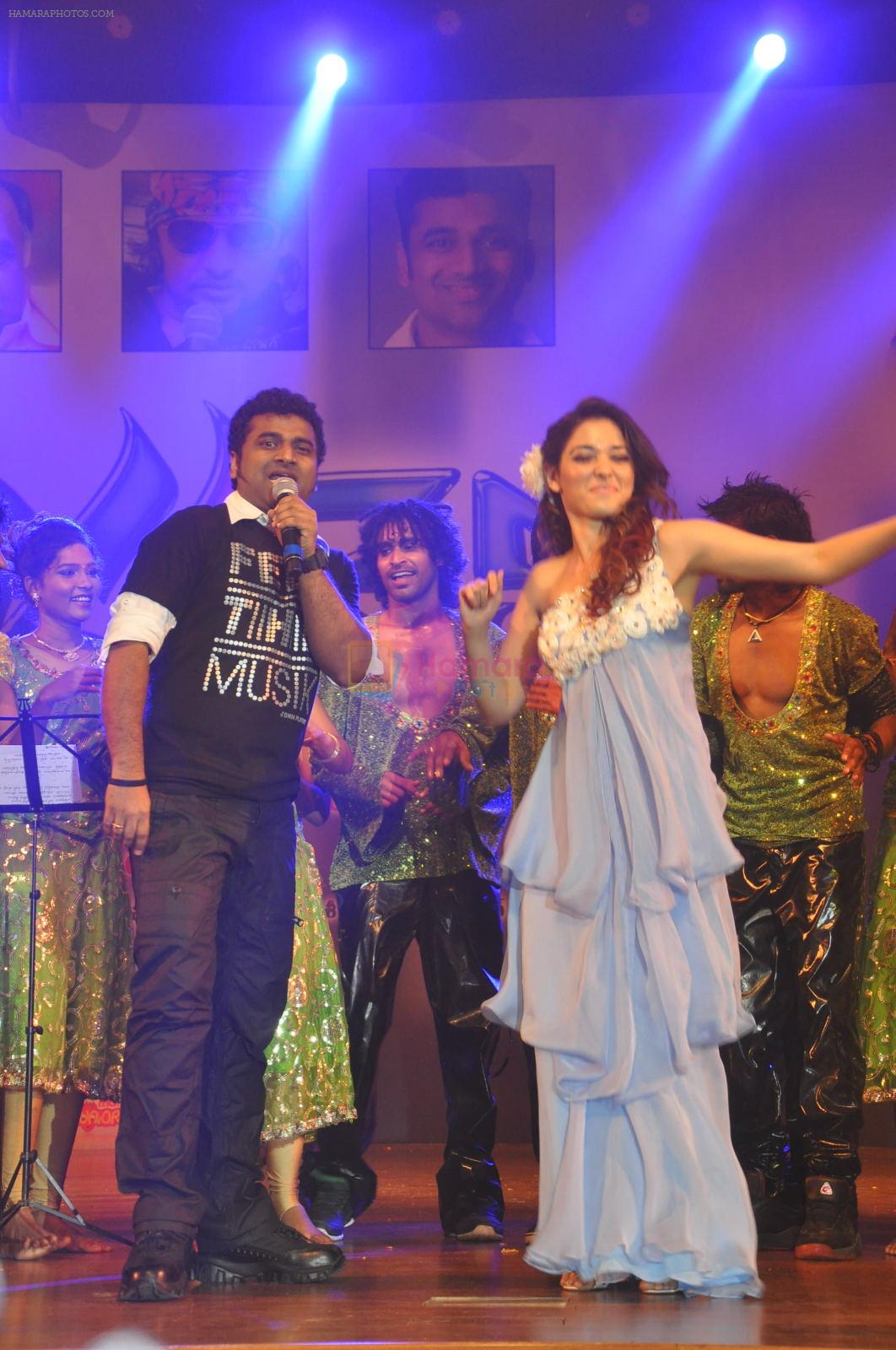Tamanna Bhatia, Junior NTR dances at the Oosaravelli Movie Audio Launch on 14th September 2011