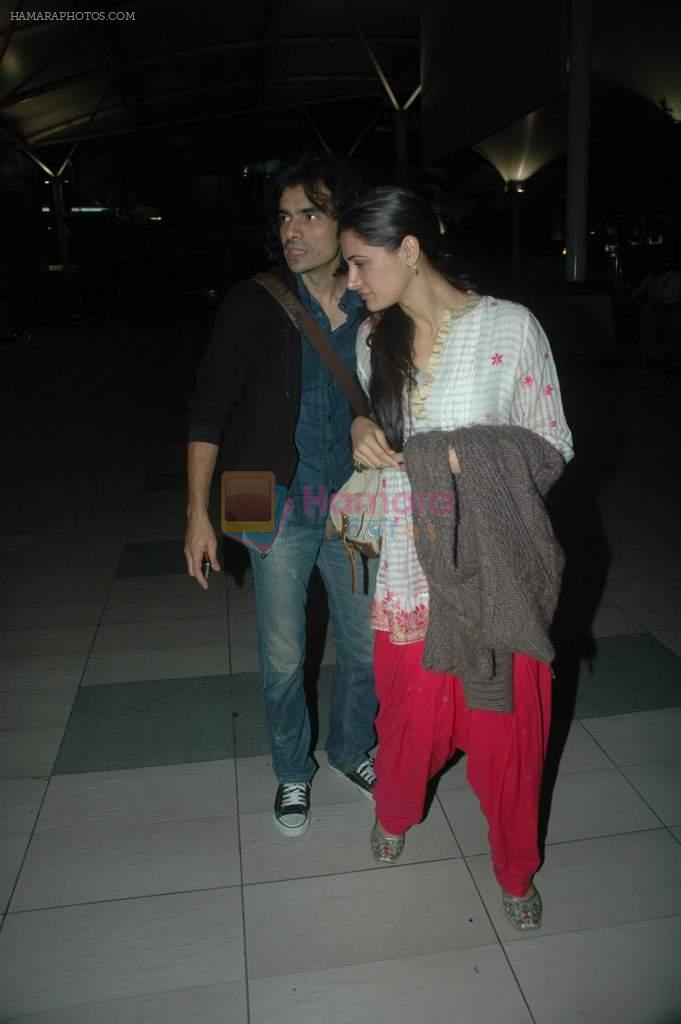 Imtiaz Ali, Nargis Fakhri snapped at the airport in Mumbai on 9th Nov 2011