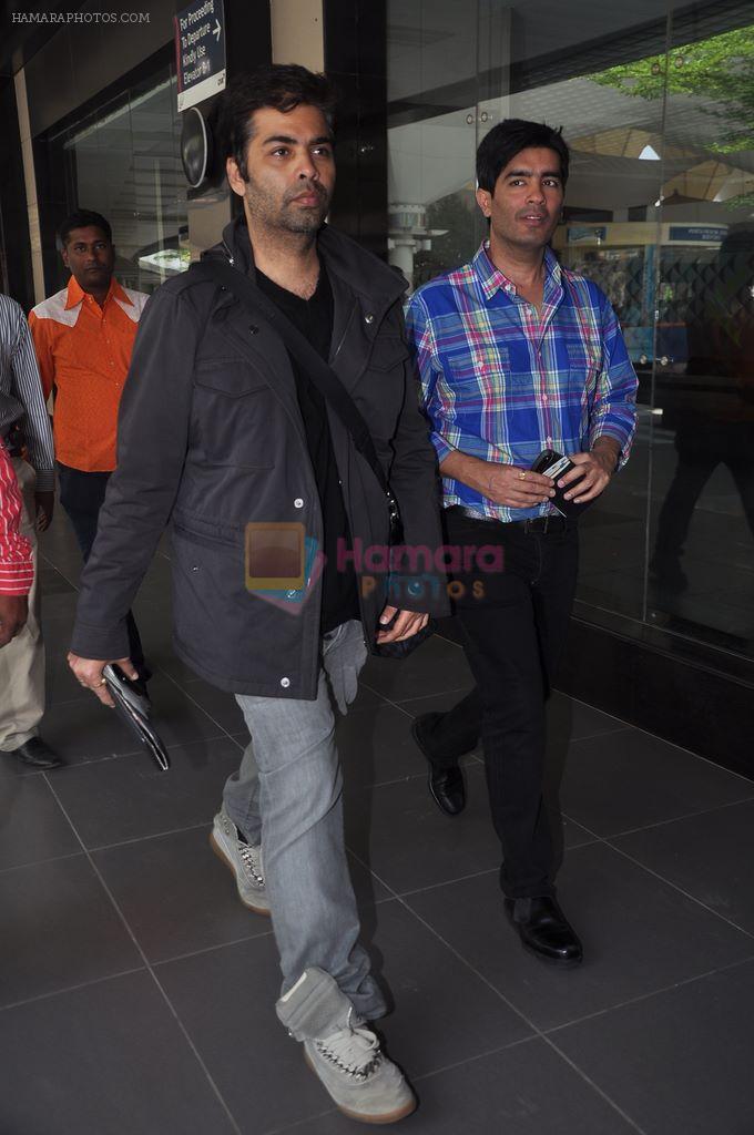 Karan Johar and  Manish Malhotra snapped at Airport in Mumbai on 11th March 2012-1